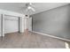 Spacious bedroom with tiled floors, a ceiling fan, and closet with doors at 2809 Mason Ave, Las Vegas, NV 89102