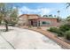 Charming exterior view of a two-story home with a well-manicured front yard and curved driveway at 2809 Mason Ave, Las Vegas, NV 89102
