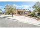 Front exterior showcases a two-story home with a circular driveway and mature trees at 2809 Mason Ave, Las Vegas, NV 89102