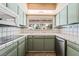Bright kitchen featuring stainless steel appliances and tiled countertops at 2809 Mason Ave, Las Vegas, NV 89102