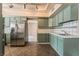 Well-lit kitchen featuring stainless steel refrigerator and ample countertop space at 2809 Mason Ave, Las Vegas, NV 89102