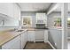 Bright kitchen features white cabinets, laminate countertops, and stainless steel sink at 2809 Mason Ave, Las Vegas, NV 89102