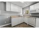 Well-lit kitchen with neutral colors, white cabinetry, and laminate counters at 2809 Mason Ave, Las Vegas, NV 89102