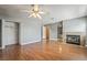 Spacious living room with fireplace, wood floors, and access to bathroom at 2809 Mason Ave, Las Vegas, NV 89102