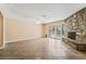 Bright living room features a stone fireplace, tile floors and glass doors opening to the outdoors at 2809 Mason Ave, Las Vegas, NV 89102