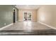 Large living room with tile floors, neutral paint, and sliding doors to the backyard at 2809 Mason Ave, Las Vegas, NV 89102