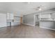 Spacious living room featuring tile floors, built-in shelves, and a breakfast bar at 2809 Mason Ave, Las Vegas, NV 89102