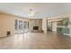 Spacious living room features tile floors, stone fireplace, and access to the backyard through glass doors at 2809 Mason Ave, Las Vegas, NV 89102