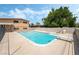 A beautiful pool with diving board, backyard, and mature trees in the background at 2809 Mason Ave, Las Vegas, NV 89102