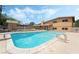 Backyard view of a pool and home exterior with mature trees and a shed at 2809 Mason Ave, Las Vegas, NV 89102
