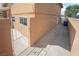 Gated side yard with walkway to backyard and trash container at 2809 Mason Ave, Las Vegas, NV 89102