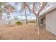 Expansive backyard featuring desert landscaping, mature trees, a swing and outdoor kitchen at 2819 Taylor Ave, North Las Vegas, NV 89030