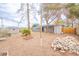Large backyard offers a storage shed, mature trees, and potential for customization at 2819 Taylor Ave, North Las Vegas, NV 89030