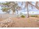 Spacious backyard featuring desert landscaping, shade trees, and a swing set at 2819 Taylor Ave, North Las Vegas, NV 89030
