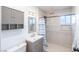 Modern bathroom featuring updated fixtures, a tiled shower with glass door, and a stylish vanity with ample storage at 2819 Taylor Ave, North Las Vegas, NV 89030