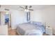 Bedroom featuring wood-look floors and a view into an adjacent room with an open door at 2819 Taylor Ave, North Las Vegas, NV 89030