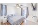Bright bedroom with light wood floors, a ceiling fan, and large windows that bring in plenty of natural light at 2819 Taylor Ave, North Las Vegas, NV 89030
