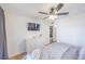 Bedroom featuring white walls, wood-look floors, a ceiling fan and a closet for storage at 2819 Taylor Ave, North Las Vegas, NV 89030