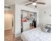 Bedroom featuring a view of the closet with organizers and adjacent room, both with light wood floors at 2819 Taylor Ave, North Las Vegas, NV 89030