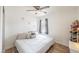 Cozy bedroom with a comfortable bed, soft pillows, neutral decor, and a ceiling fan at 2819 Taylor Ave, North Las Vegas, NV 89030