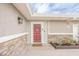 The home features a welcoming front entrance with a vibrant red door and stylish stone accents at 2819 Taylor Ave, North Las Vegas, NV 89030