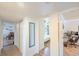 Hallway featuring wood-look floors that connects bedrooms, a living area, and closet at 2819 Taylor Ave, North Las Vegas, NV 89030