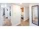 Hallway features wood-look floors, connects to the bathroom, kitchen, bedroom and a laundry room at 2819 Taylor Ave, North Las Vegas, NV 89030