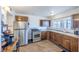 Traditional kitchen featuring stainless steel appliances and classic wood cabinets with a window above the sink at 2819 Taylor Ave, North Las Vegas, NV 89030