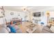 The living room and dining area blend seamlessly, with modern decor and an open layout for easy entertaining and living at 2819 Taylor Ave, North Las Vegas, NV 89030