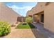 View of a backyard with fire pit, gravel, and small plants at 2964 Gunnery Forge St, Las Vegas, NV 89156