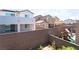 A backyard view featuring play equipment and block wall fences, bordering other homes at 2964 Gunnery Forge St, Las Vegas, NV 89156
