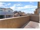 Balcony with views of the community homes and blue skies at 2964 Gunnery Forge St, Las Vegas, NV 89156