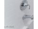 Close-up on the chrome shower fixtures in the white tiled shower at 2964 Gunnery Forge St, Las Vegas, NV 89156