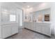 Bathroom featuring dual sinks, quartz countertops, and tile flooring at 2964 Gunnery Forge St, Las Vegas, NV 89156