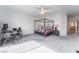 Spacious carpeted bedroom with a ceiling fan, and a computer desk near the window at 2964 Gunnery Forge St, Las Vegas, NV 89156
