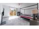 Bright, carpeted bedroom with ceiling fan, TV and sliding glass doors to a balcony at 2964 Gunnery Forge St, Las Vegas, NV 89156