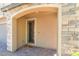 Stone archway frames the front door, creating a welcoming entrance at 2964 Gunnery Forge St, Las Vegas, NV 89156