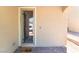 Inviting front porch with a 'hello' doormat and a glass door at 2964 Gunnery Forge St, Las Vegas, NV 89156