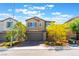 Charming two-story home featuring a two-car garage, desert landscaping, and a welcoming facade at 2964 Gunnery Forge St, Las Vegas, NV 89156
