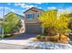 Charming two-story home featuring a two-car garage, desert landscaping, and a welcoming facade at 2964 Gunnery Forge St, Las Vegas, NV 89156