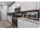 Kitchen featuring stainless steel appliances, white cabinets, and countertops at 2964 Gunnery Forge St, Las Vegas, NV 89156