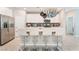 Modern kitchen with white cabinets, stainless steel appliances, and a center island with seating at 2964 Gunnery Forge St, Las Vegas, NV 89156