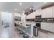 Modern kitchen with white cabinets, stainless steel appliances, and a center island with seating at 2964 Gunnery Forge St, Las Vegas, NV 89156