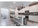 Spacious kitchen with stainless steel appliances, a kitchen island, and white cabinets at 2964 Gunnery Forge St, Las Vegas, NV 89156