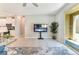 Relaxing living room area with access to backyard through sliding glass doors and views of kitchen at 2964 Gunnery Forge St, Las Vegas, NV 89156