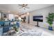 Open-concept living area featuring modern decor, a ceiling fan, and a view into the kitchen at 2964 Gunnery Forge St, Las Vegas, NV 89156