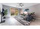Inviting living room with a sliding glass door leading to outdoor space, offering a seamless indoor-outdoor flow at 2964 Gunnery Forge St, Las Vegas, NV 89156