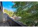 Balcony area surrounded by mature trees on a sunny day at 3260 Longford Way, Las Vegas, NV 89121