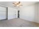 Spacious bedroom with neutral carpet, ceiling fan, and closet at 3260 Longford Way, Las Vegas, NV 89121