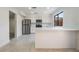 Bright kitchen featuring stainless steel appliances, a breakfast bar, and lots of counter space at 3260 Longford Way, Las Vegas, NV 89121